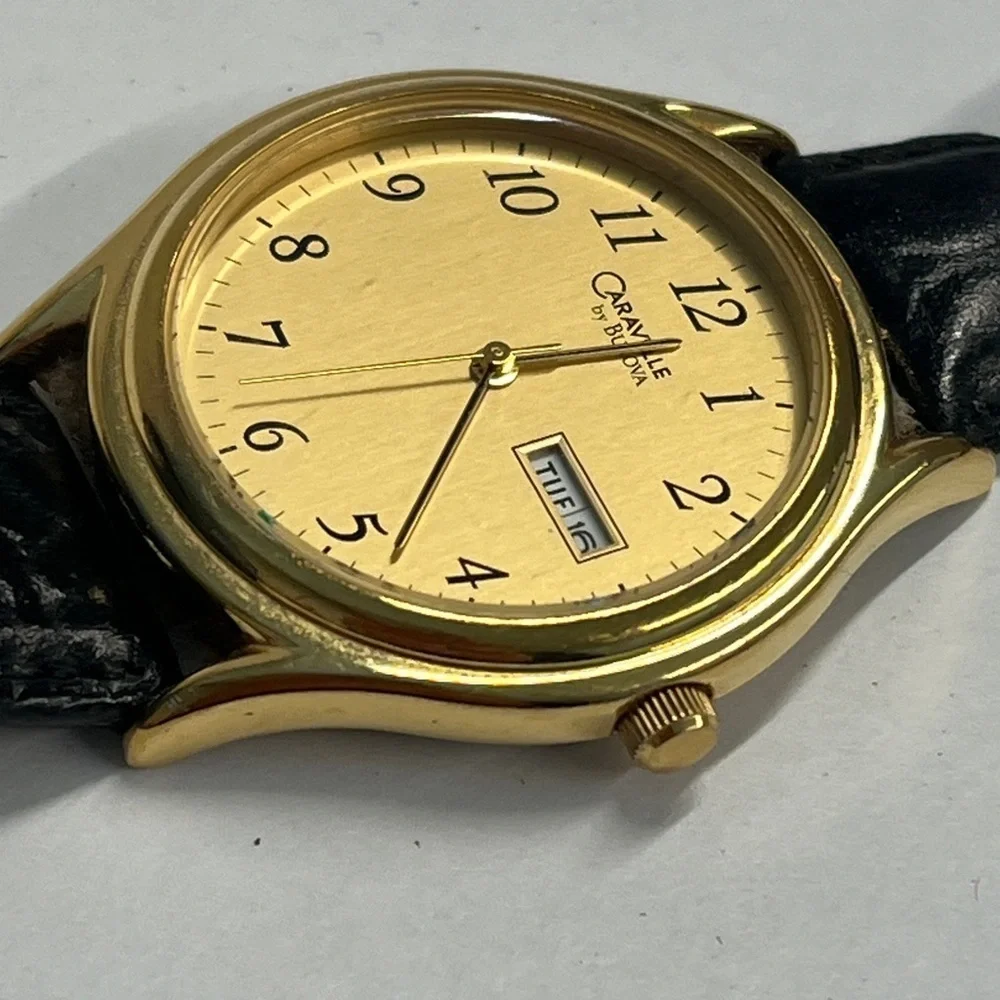 Caravelle by Bulova Vintage Quarts Watch Day Date Second Hand Function